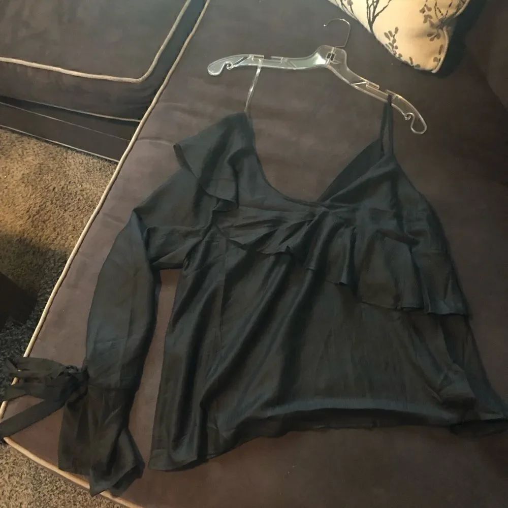 NWT Lush one sleeve top , long sleeve has tie, can be worn several ways. Cute